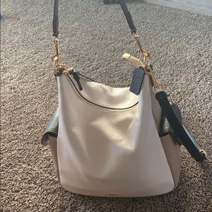 Cream, black, and Tan Coach purse